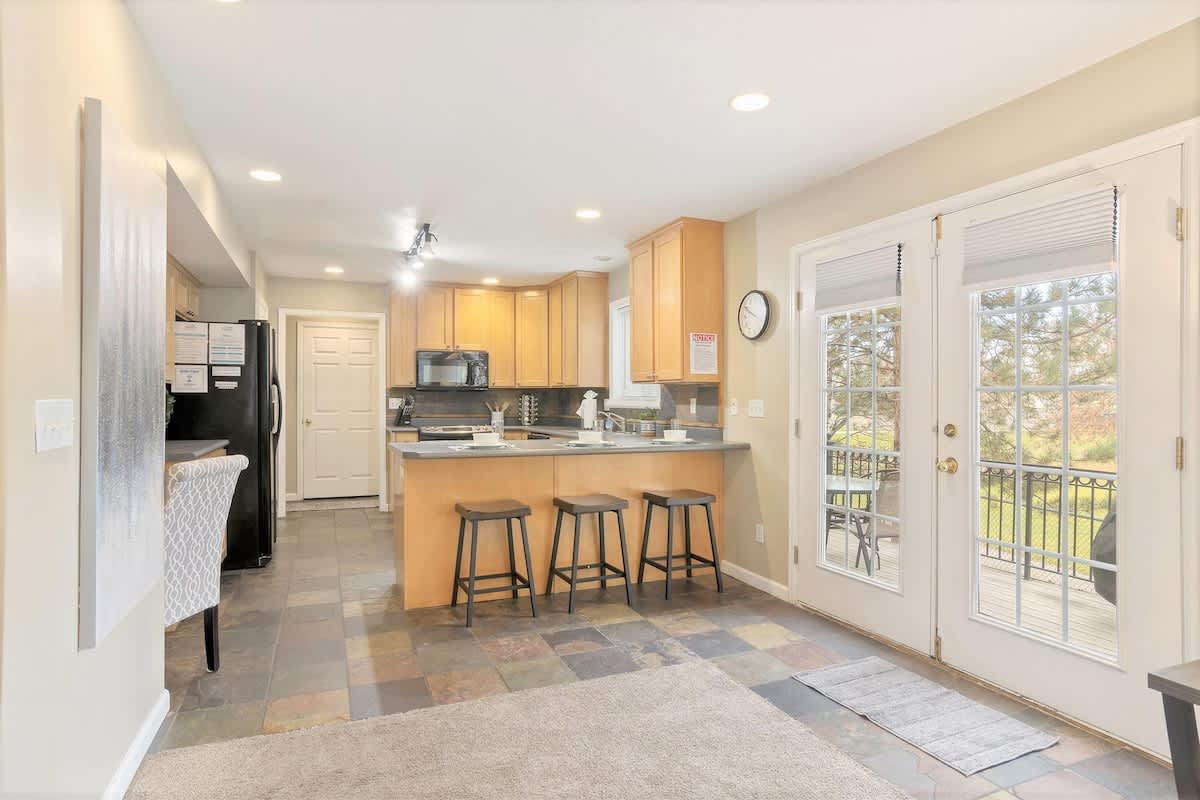 Kitchen with door to private hot tub and BBQ