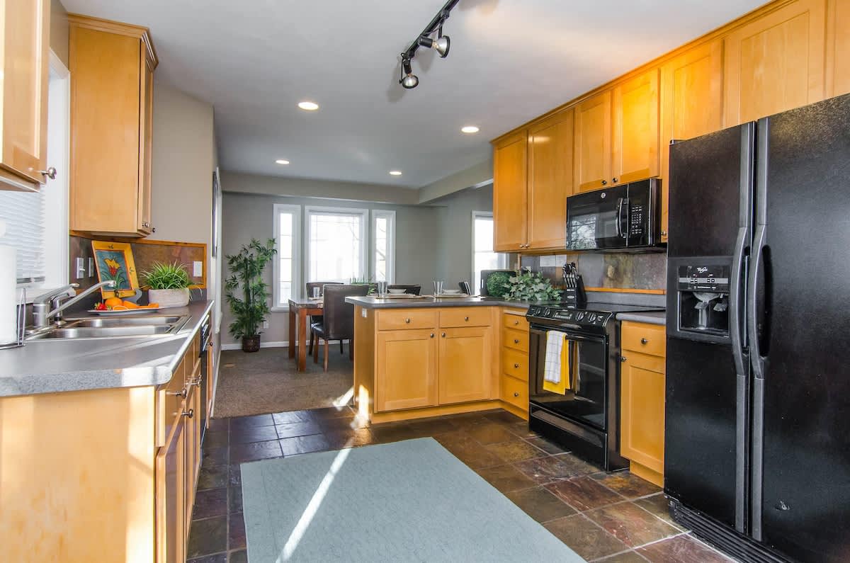 Beautiful kitchen with slate floors and nice appliances