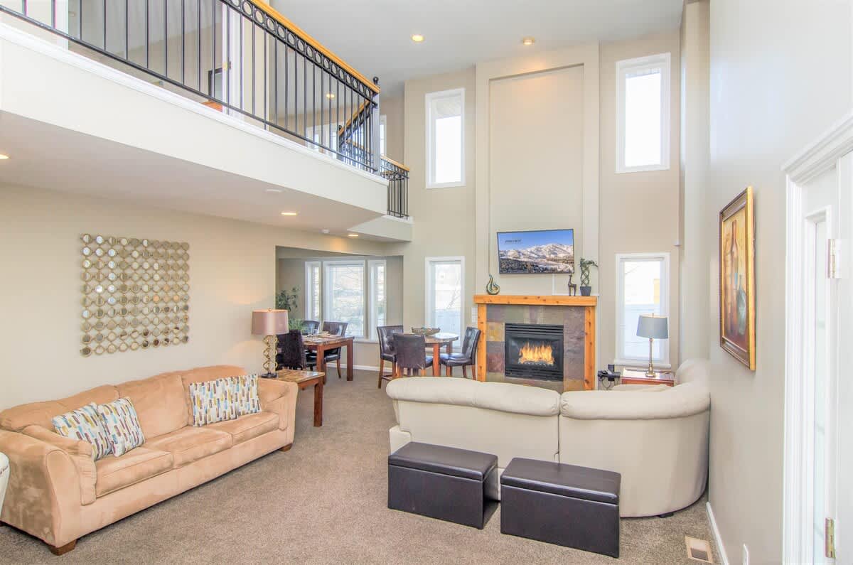 Open concept great room with sectional and sofa sleeper