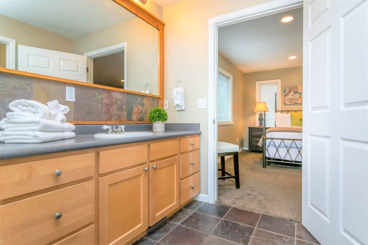 Master bathroom vanity and slate tile floor