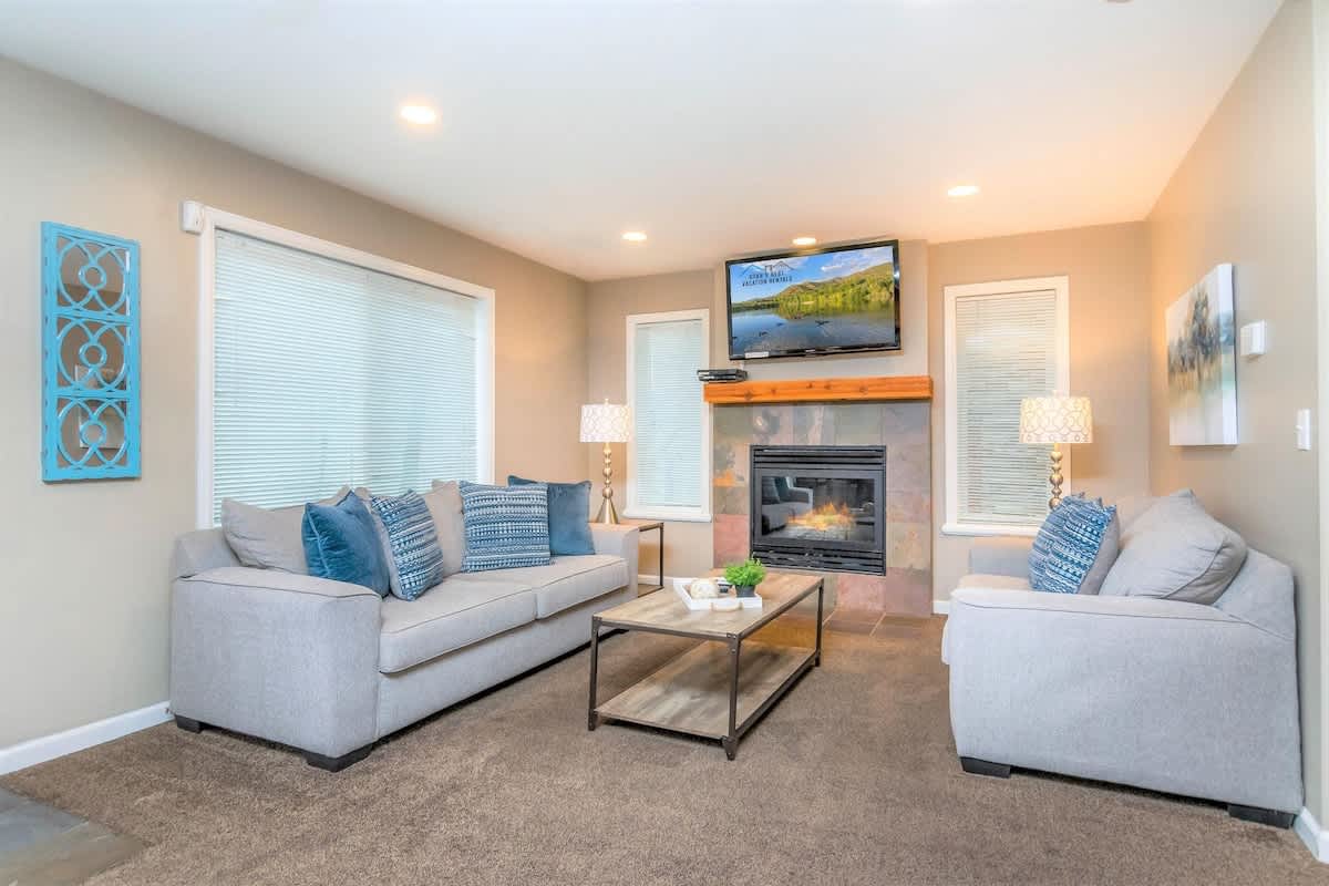 Living Room with comfortable sofas, fireplace and TV