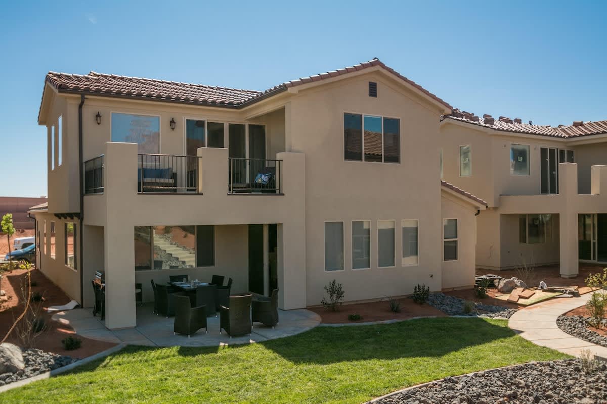 Beautiful home with upper balcony, a fire pit and lawn