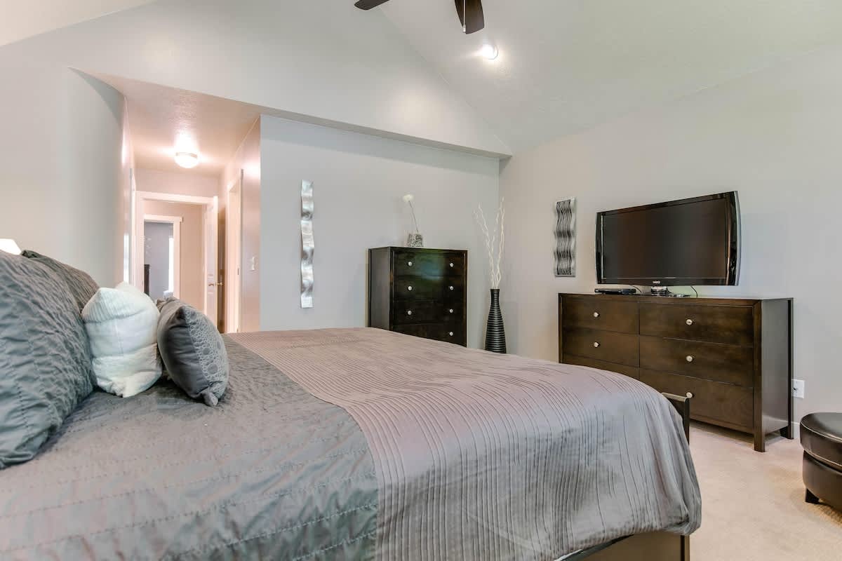 Master suite with king bed and TV