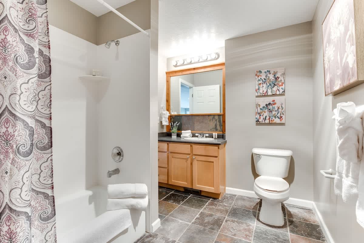 Tub/shower combo and accessed through hall or privately through bedroom 2