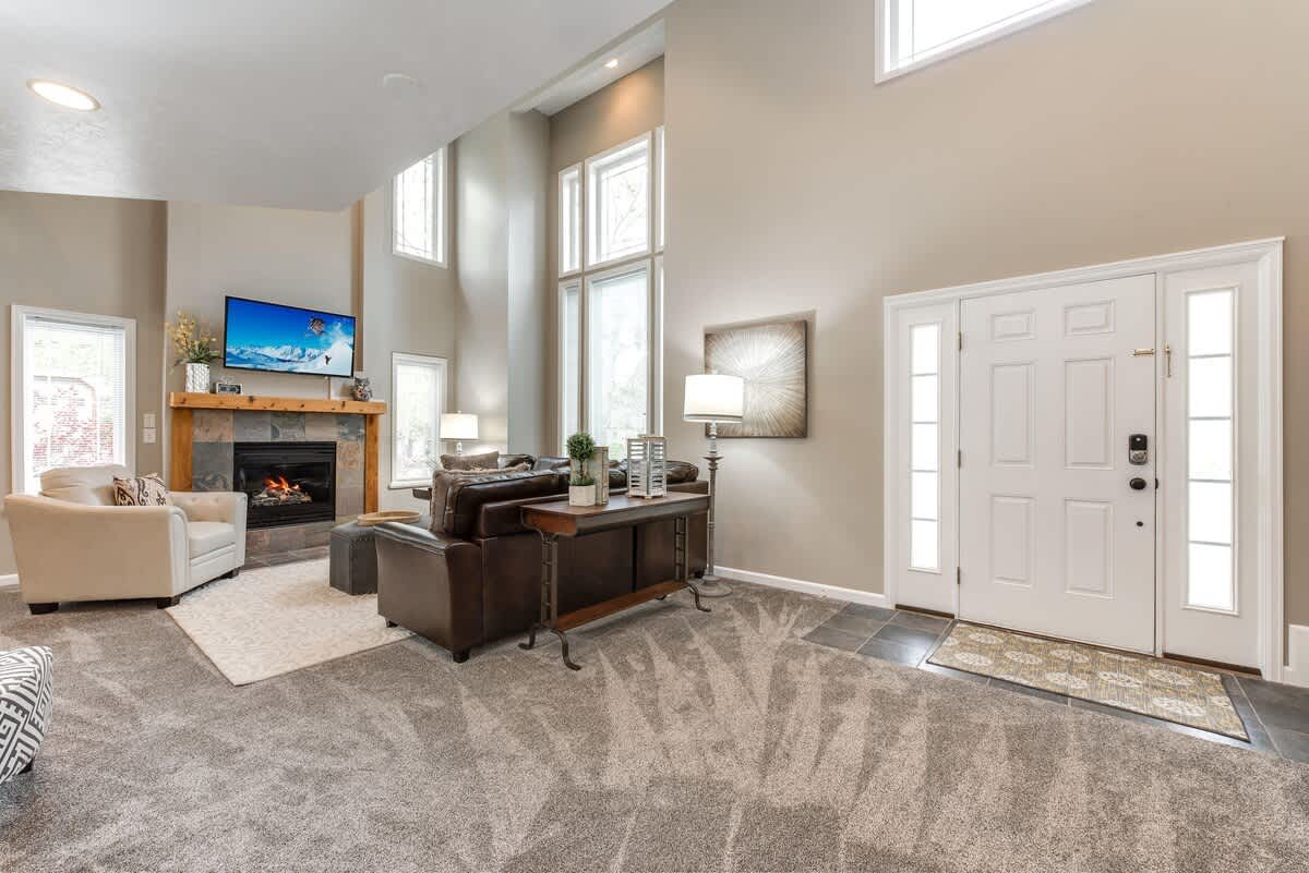 Spacious great room with 30 foot ceiling and sectional to relax