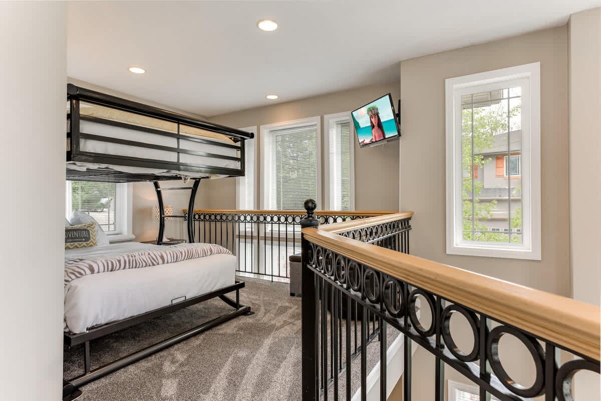 Fun sleeping nook with full bunk bed, TV, overlooking lower great room