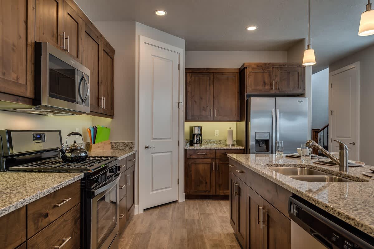 Kitchen is fully stocked with appliances and utensils for cookin
