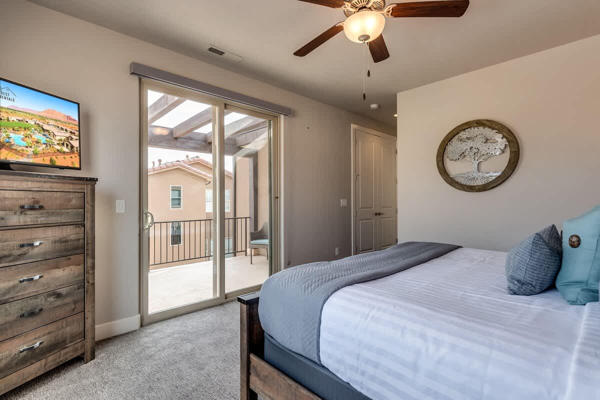 Master bedroom 2 upstairs with king bed, TV, covered balcony