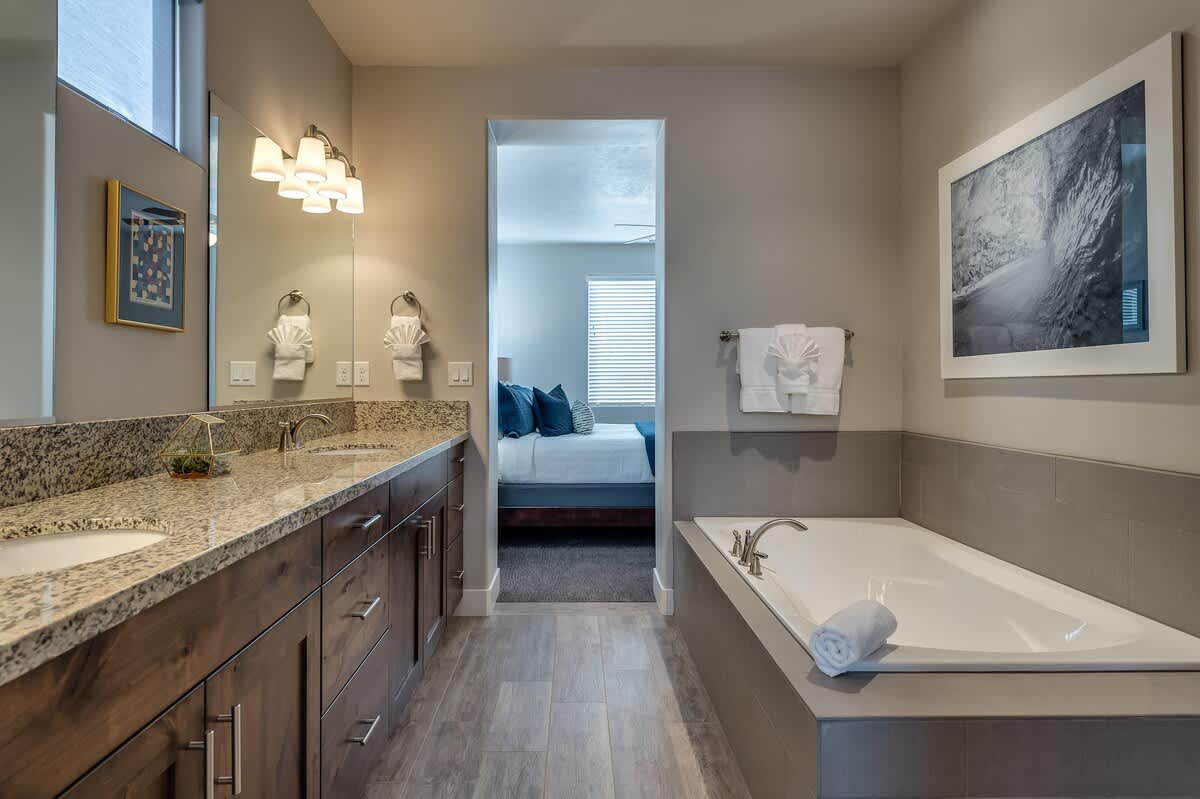 Master bathroom with dual sinks and garden tub