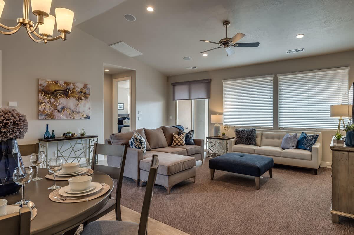Open concept family room and dining area with stylish decor