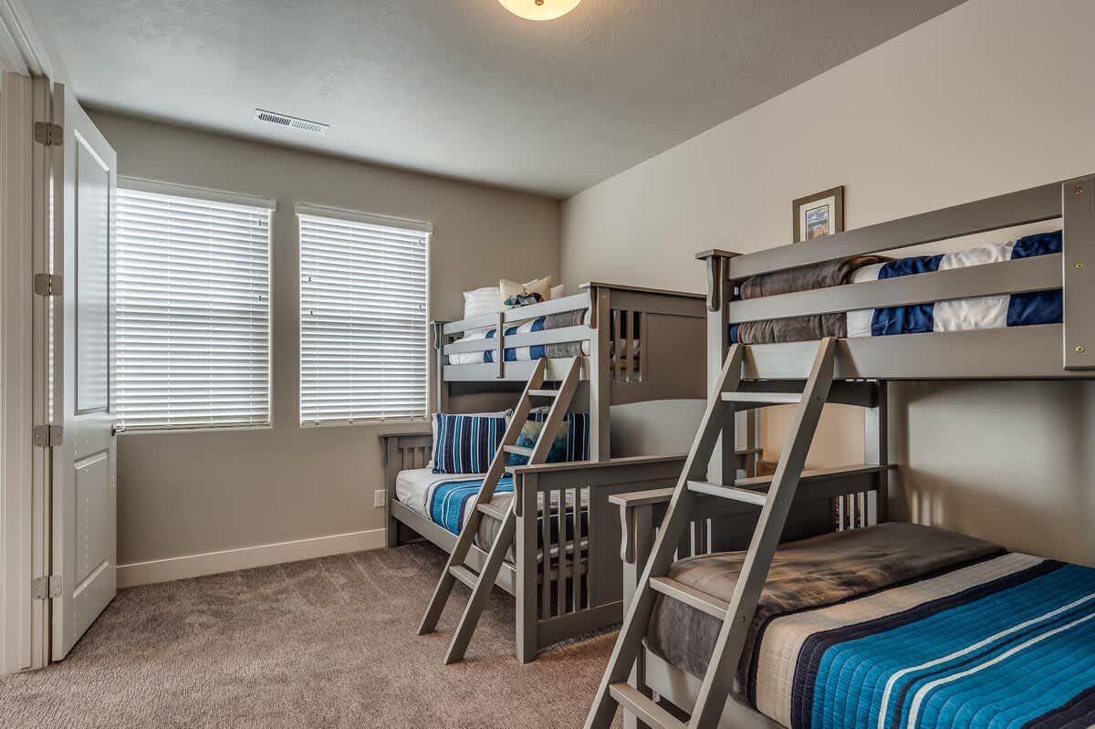 Bunk bedroom upstairs with 2 twin over full bunk beds