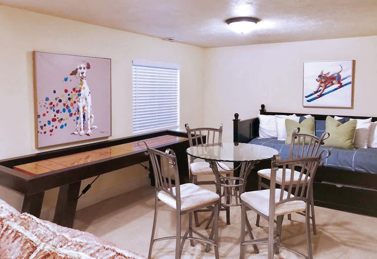 Shuffleboard and recreation area in basement family room