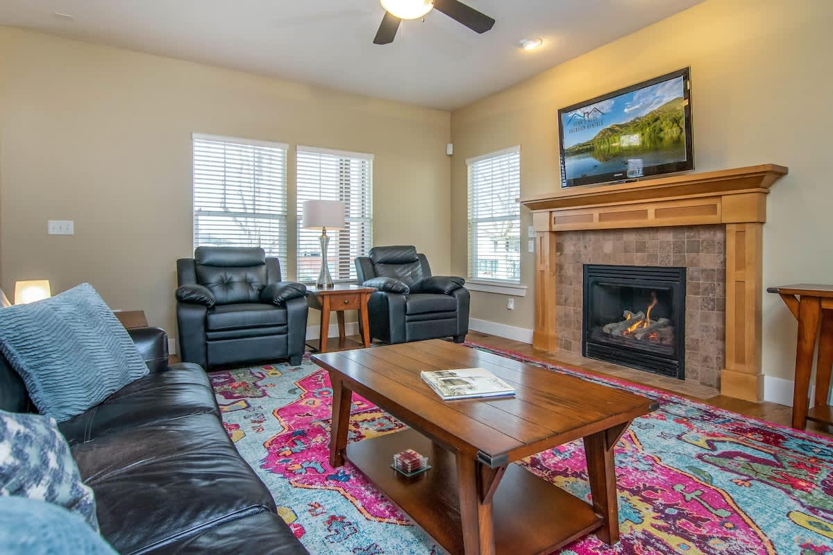 Beautiful family room with fireplace and TV and leather seating