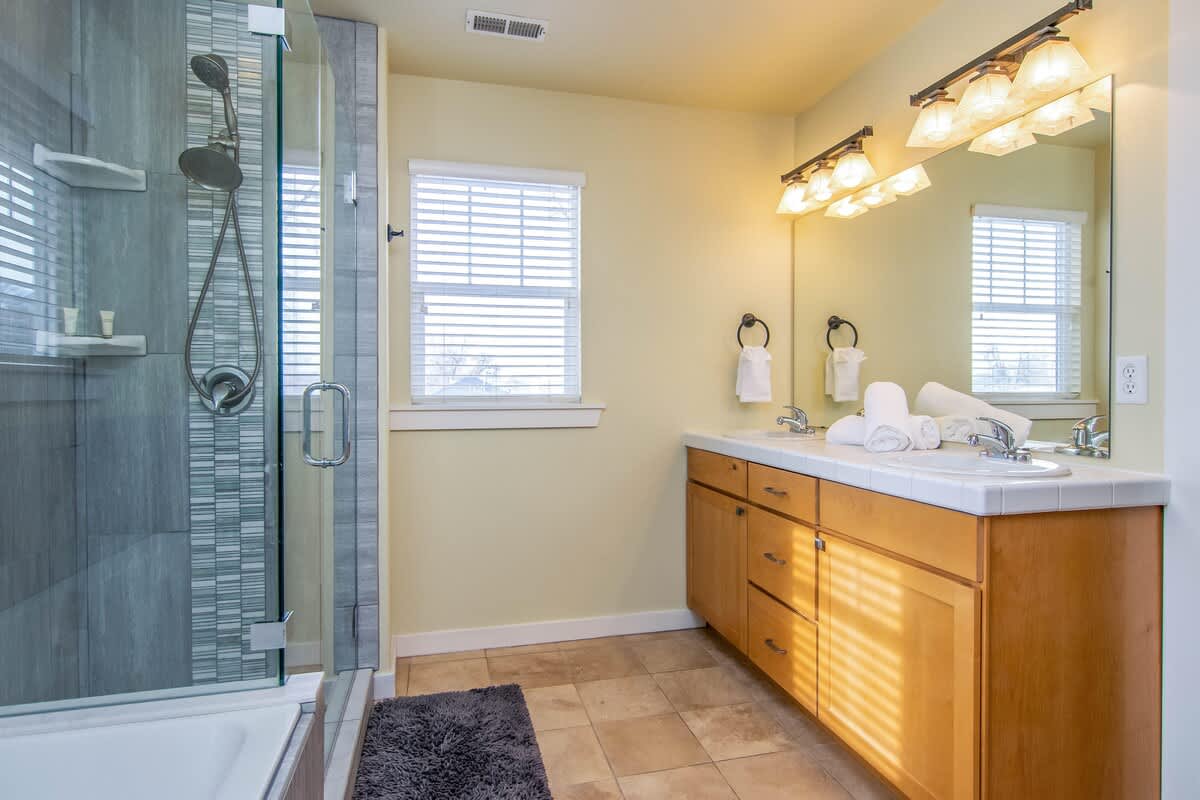 Walk-in shower, double sink vanity and jetted tub