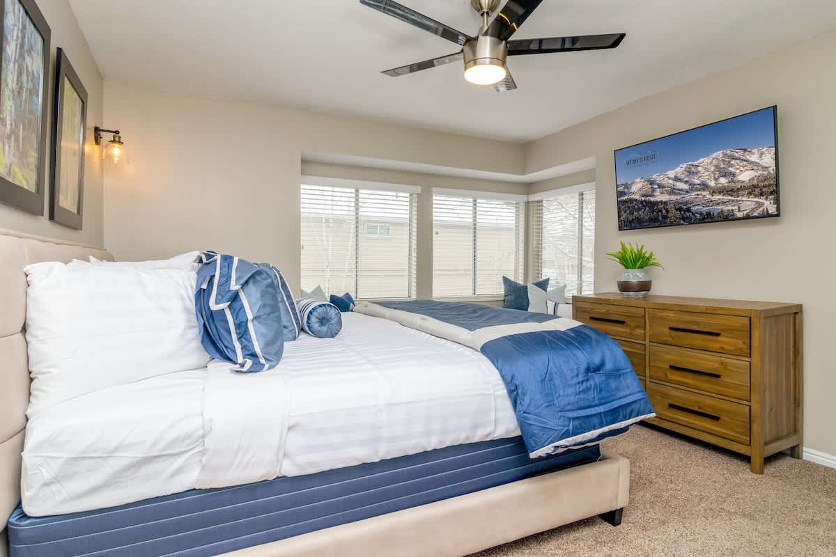 Master bedroom with king bed and large TV
