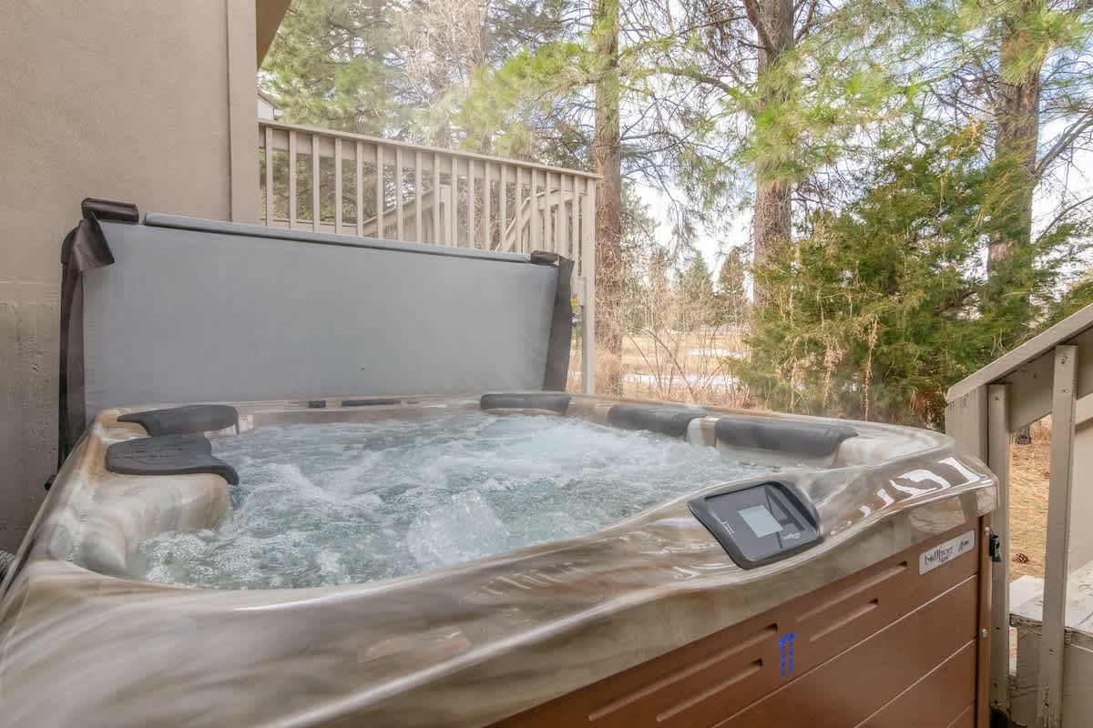 Enjoy your own private hot tub with view into the trees