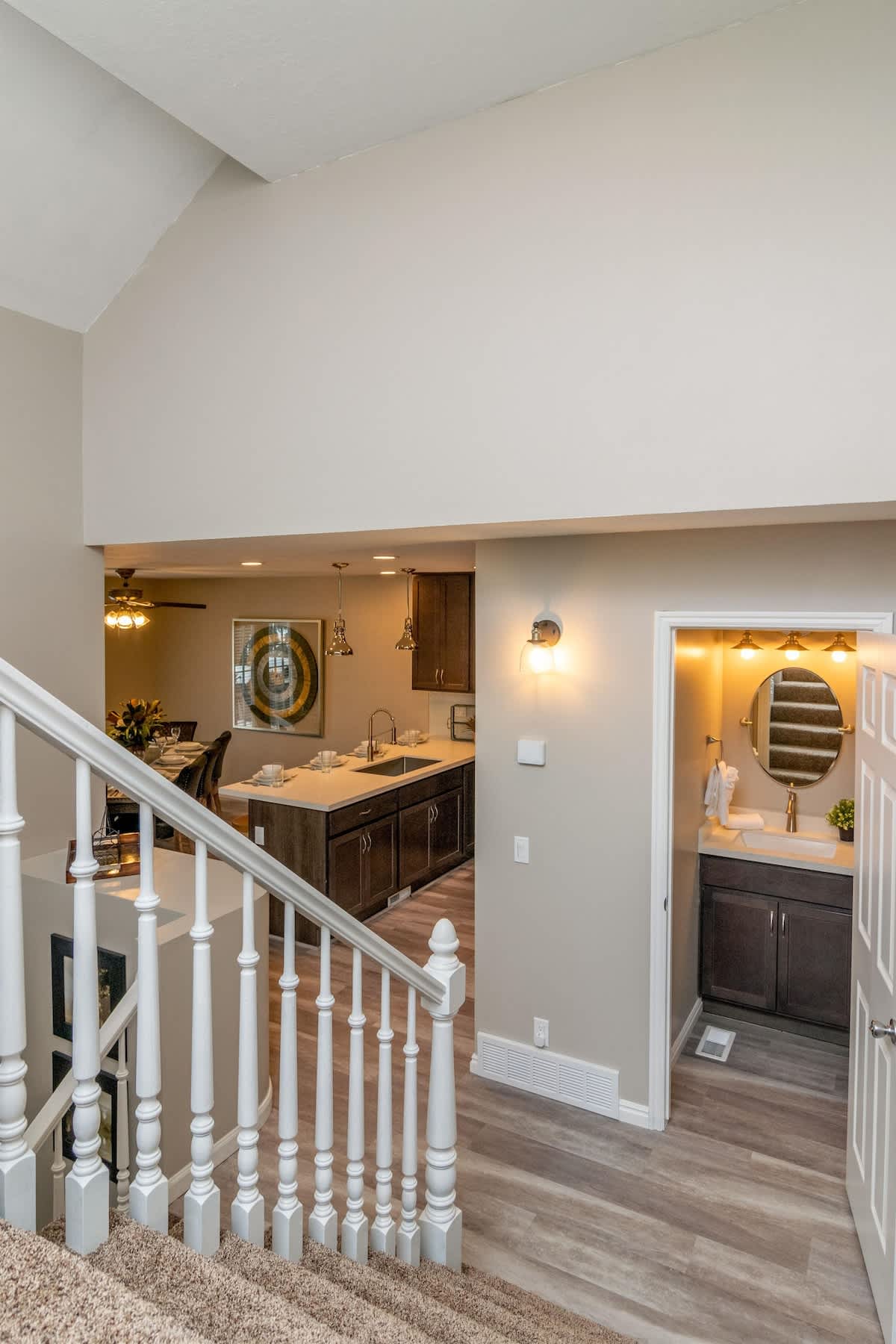 Half bath off the kitchen and stairs to master bedroom