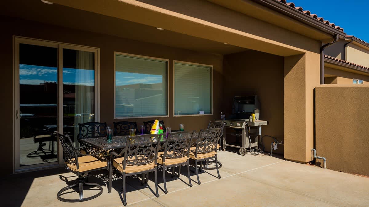 Covered patio with dining set for 8 and BBQ