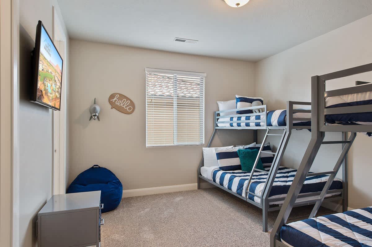 Sleep up to 6 in this ocean-themed bunk room with TV