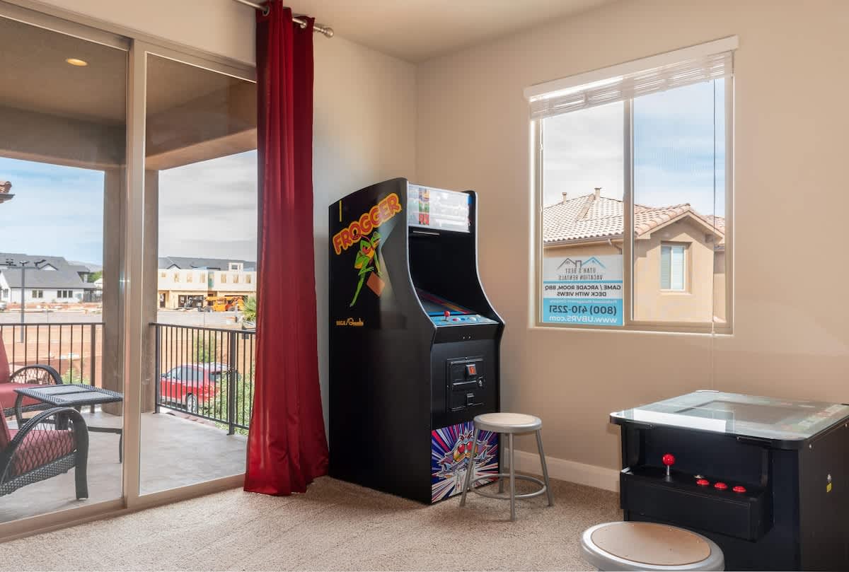 2 arcades with Donkey Kong and a Frogger games and balcony