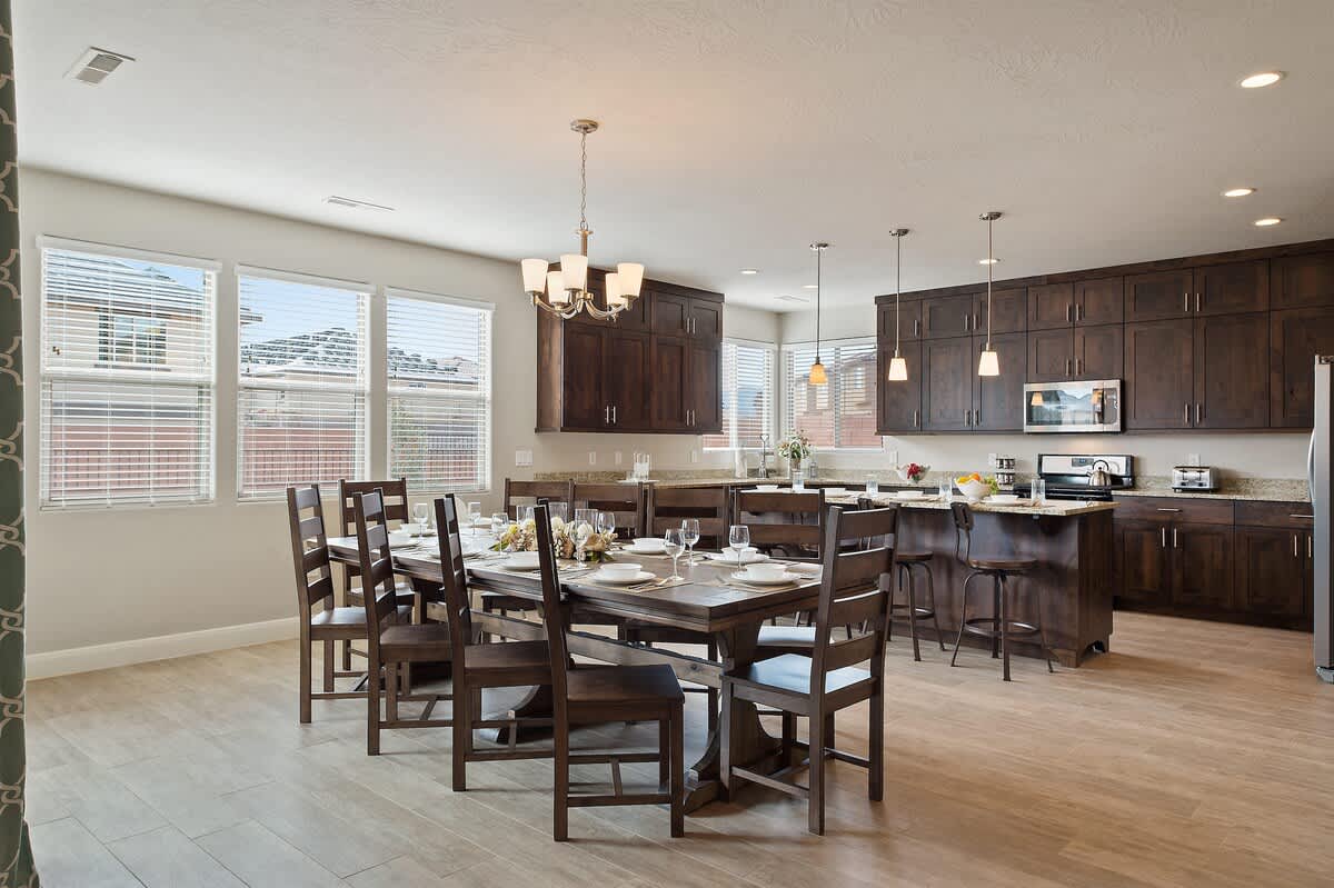 Large open concept kitchen with dining table for 10 and bar
