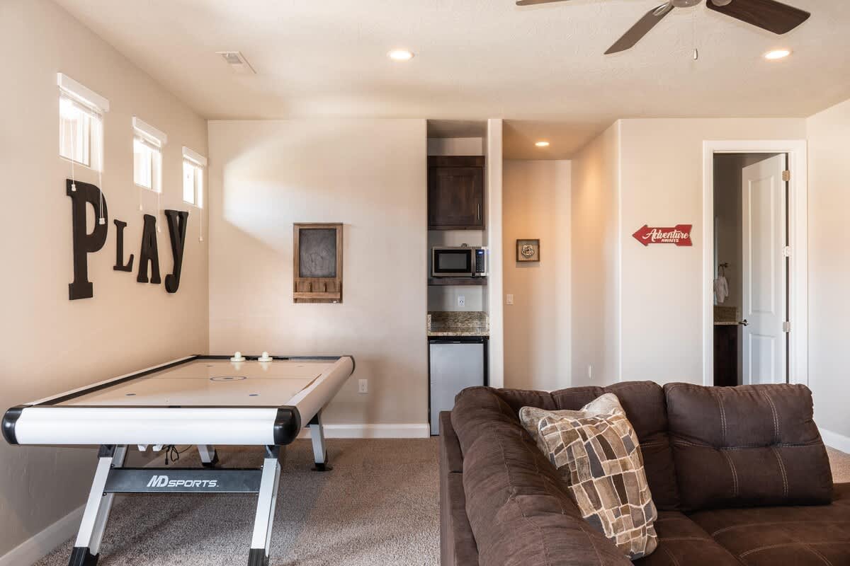 Enjoy air hockey table, mini fridge, microwave, TV, PS4 console