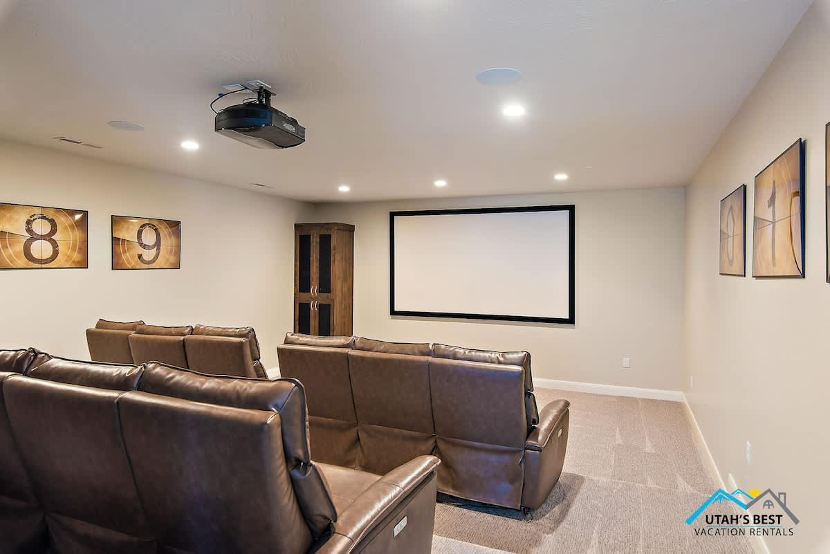 Large in-home theater with tiered recliner seating