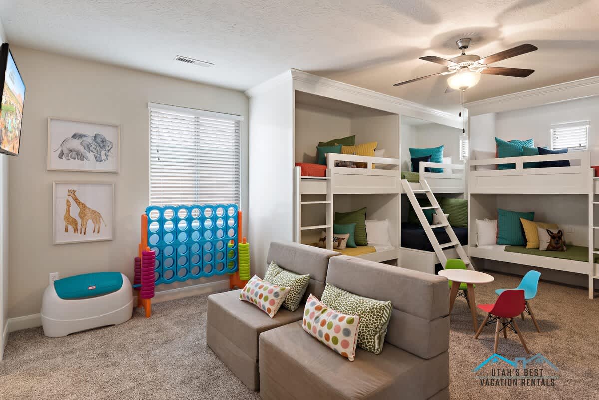 The coolest bunk room setup with play furniture