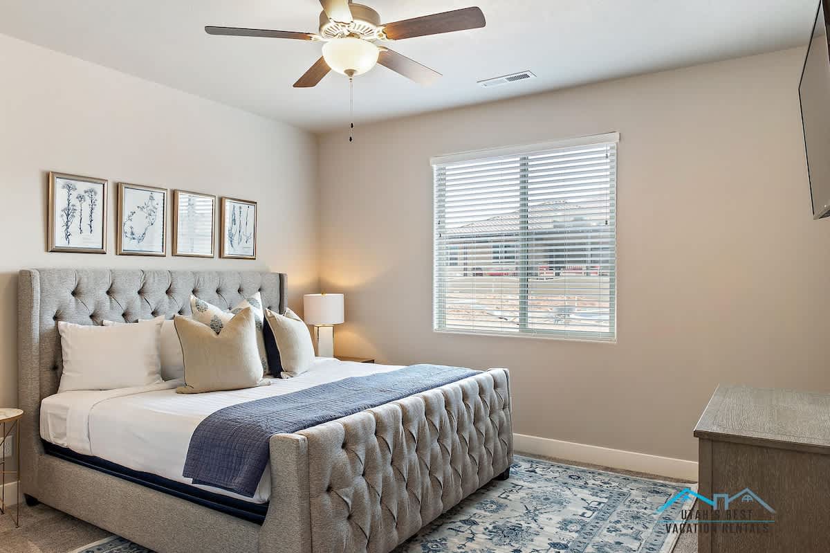 Master bedroom with gorgeous tufted king bed