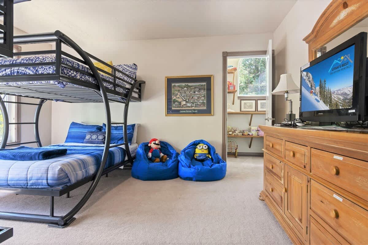 Bunk room also offers TV, and game chairs