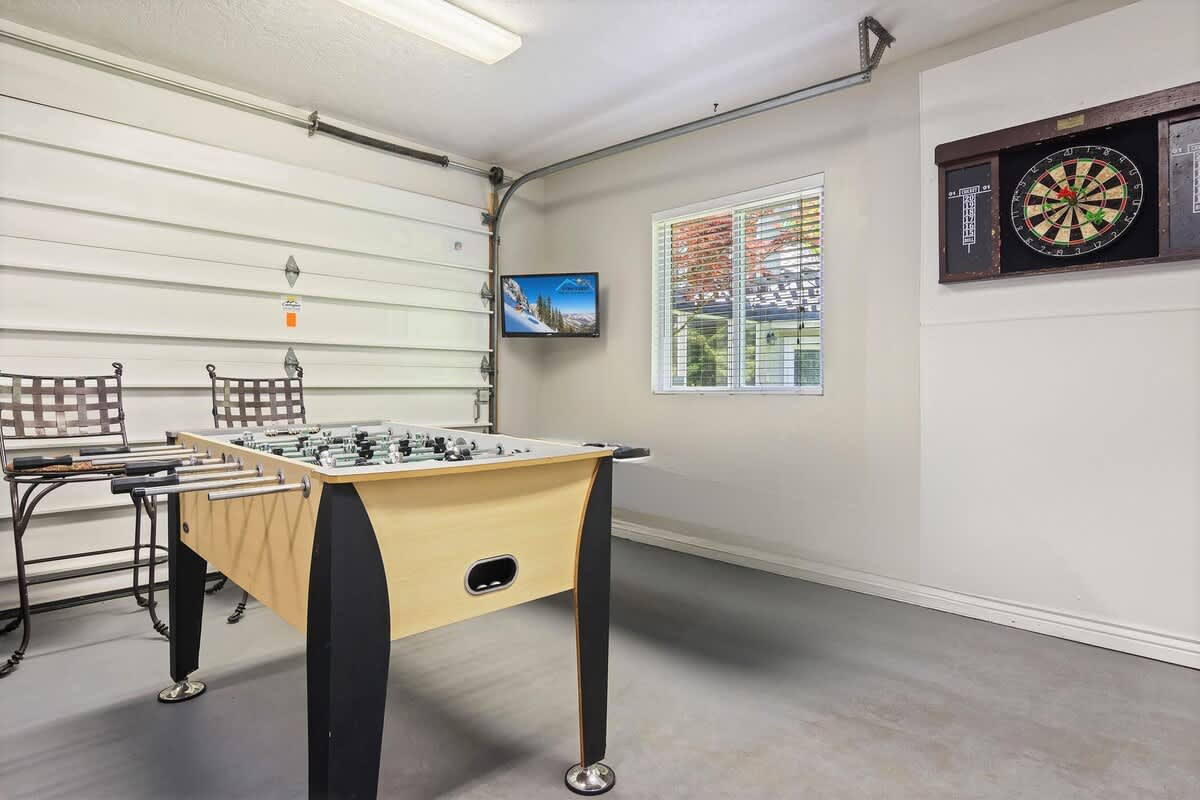 Game room in detached guesthouse with darts and foosball