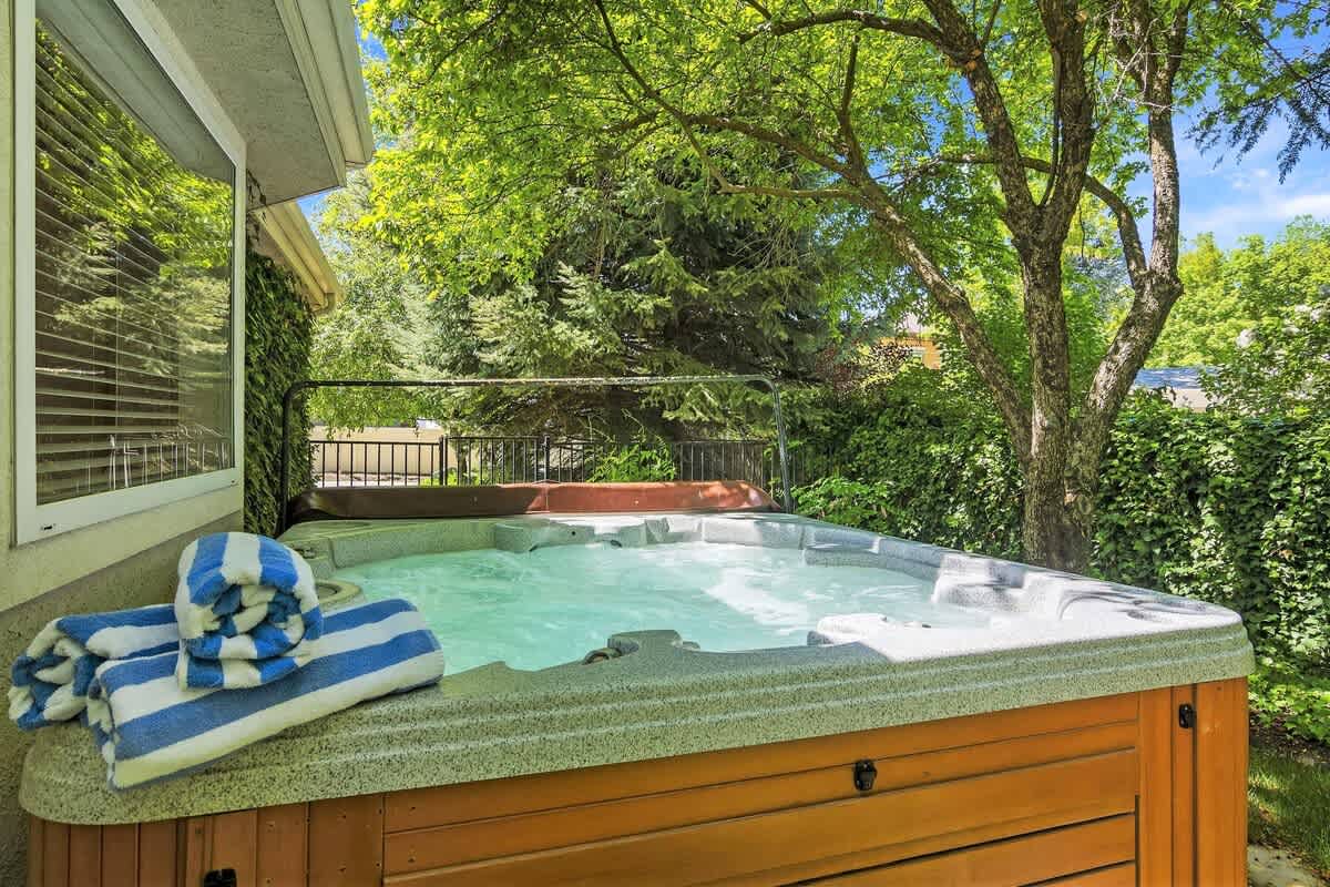 Private hot tub secluded under mature trees in private courtyard