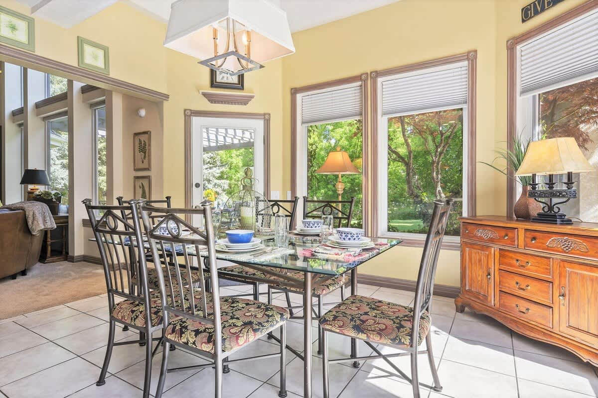 Breakfast parlor with glass table seats 6 with garden view