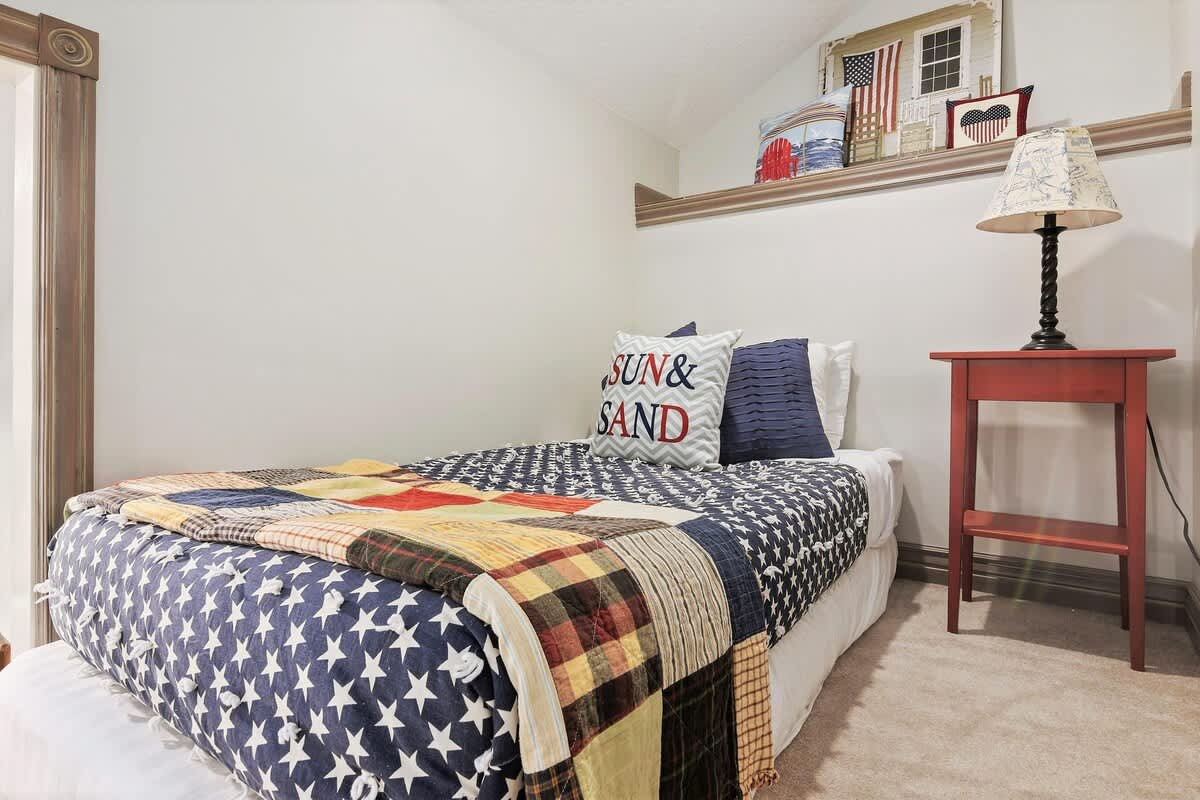 Kids treehouse loft with twin mattress and lamp