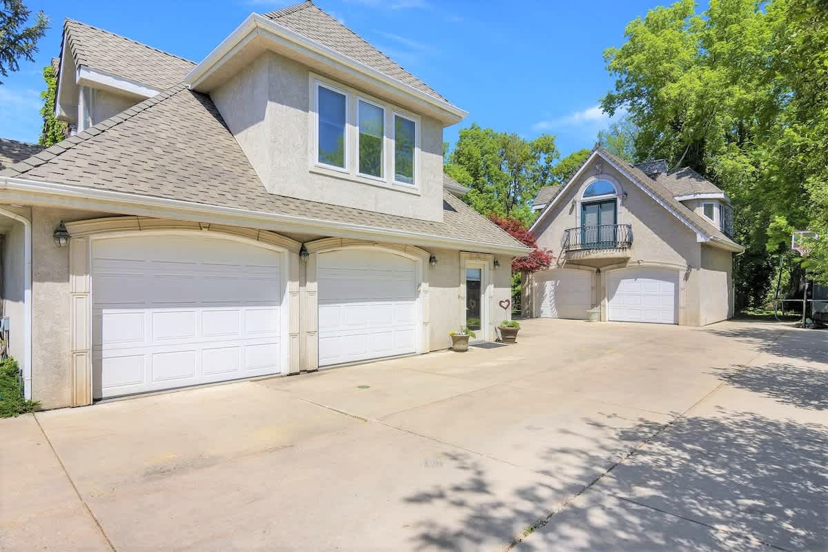Main house and guesthouse with 2-car garage and large driveway