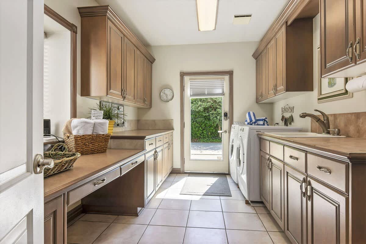 Mudroom with washer and dryer and small desk