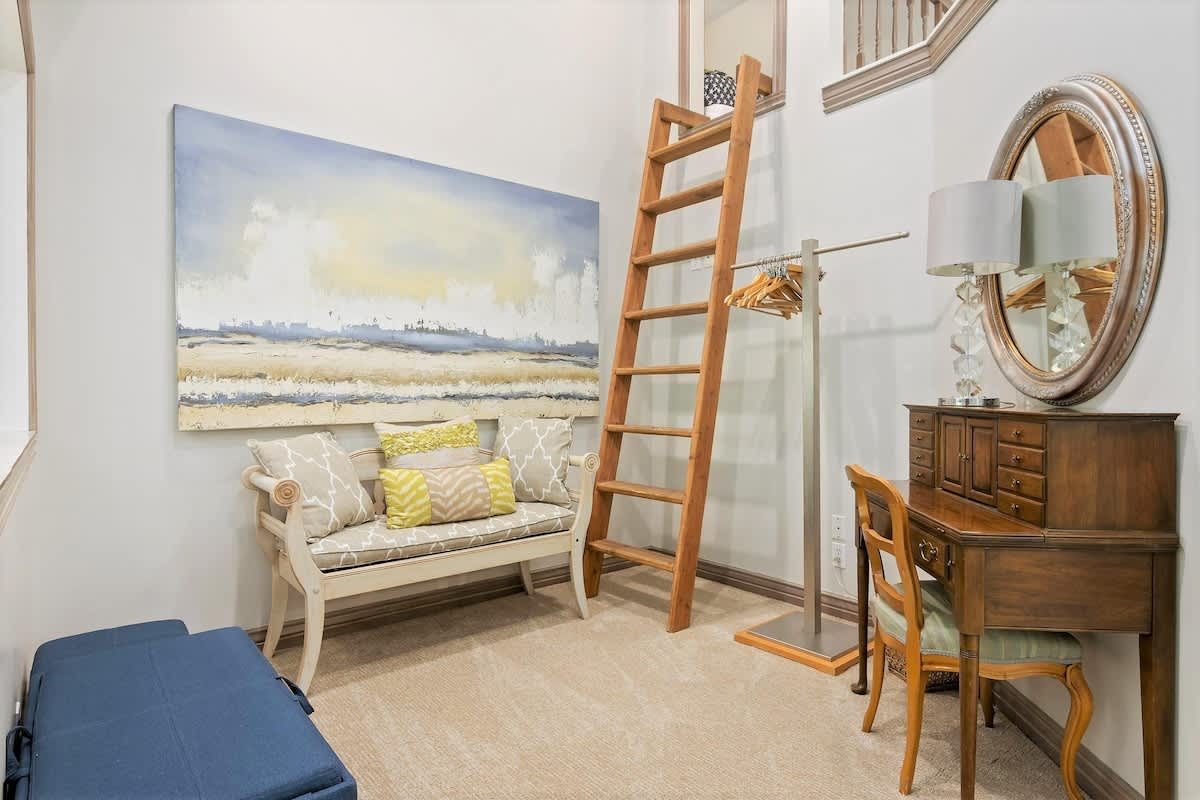 Master bedroom nook with ladder to kids treehouse loft