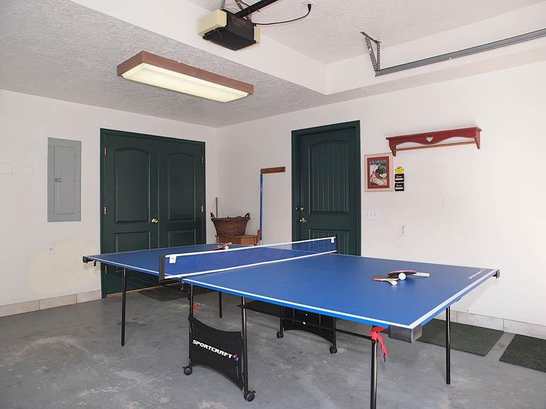 Ping pong table in garage - fold up on wheels
