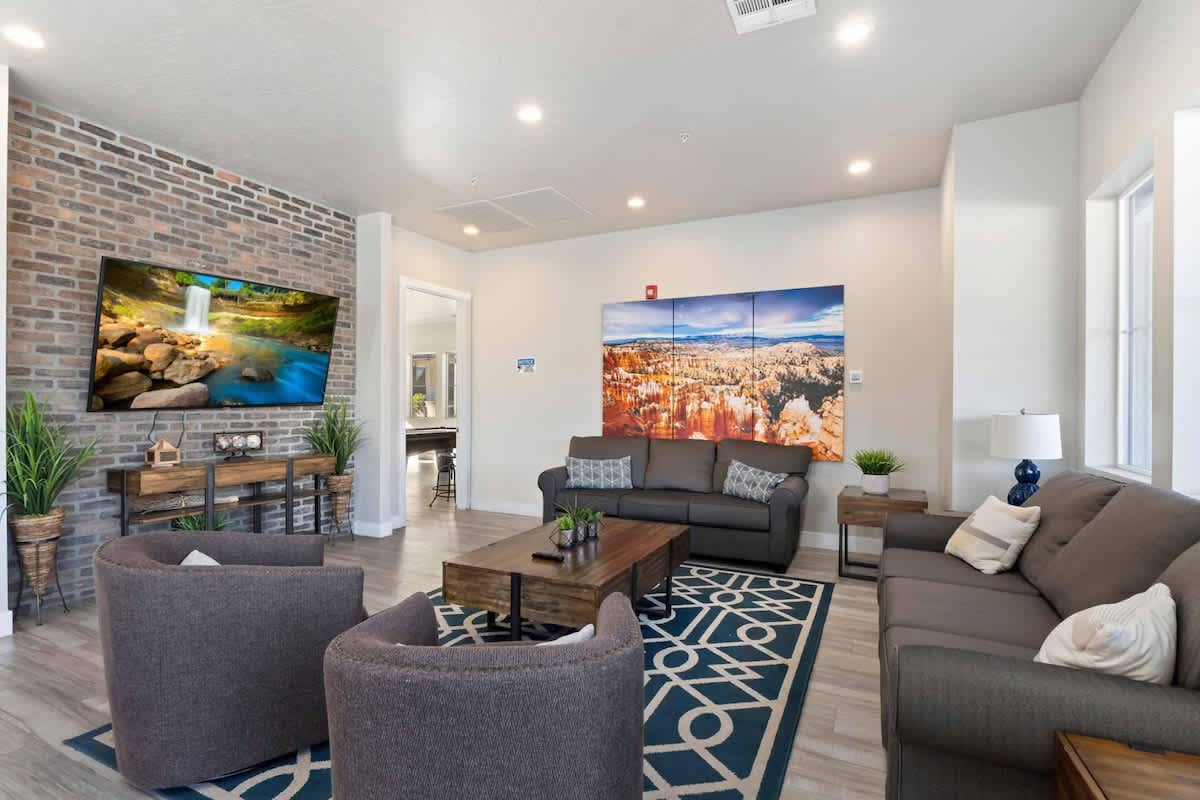 Community clubhouse with lounge, TV, games and patio