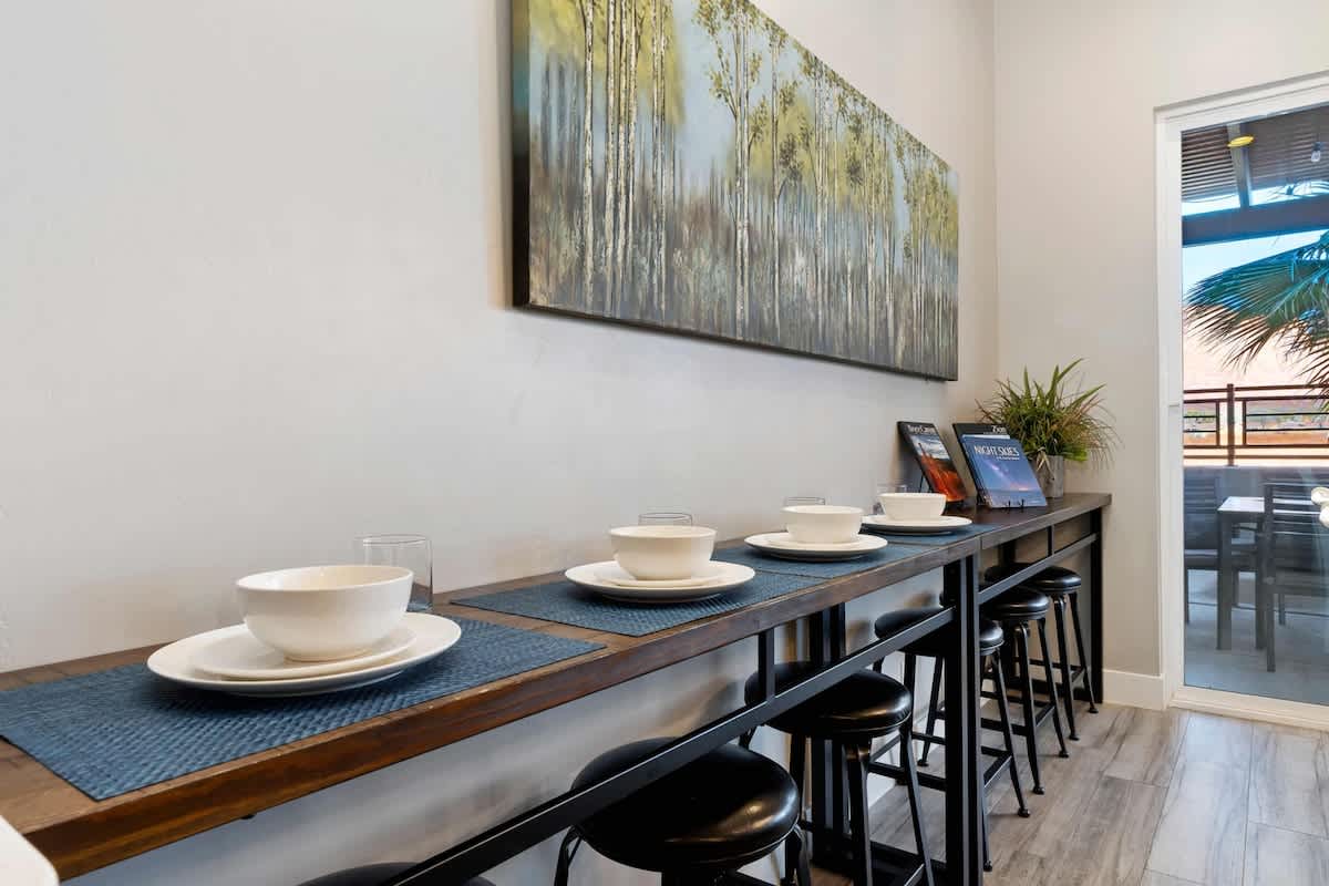 Dining area has bar with seating for an extra 6