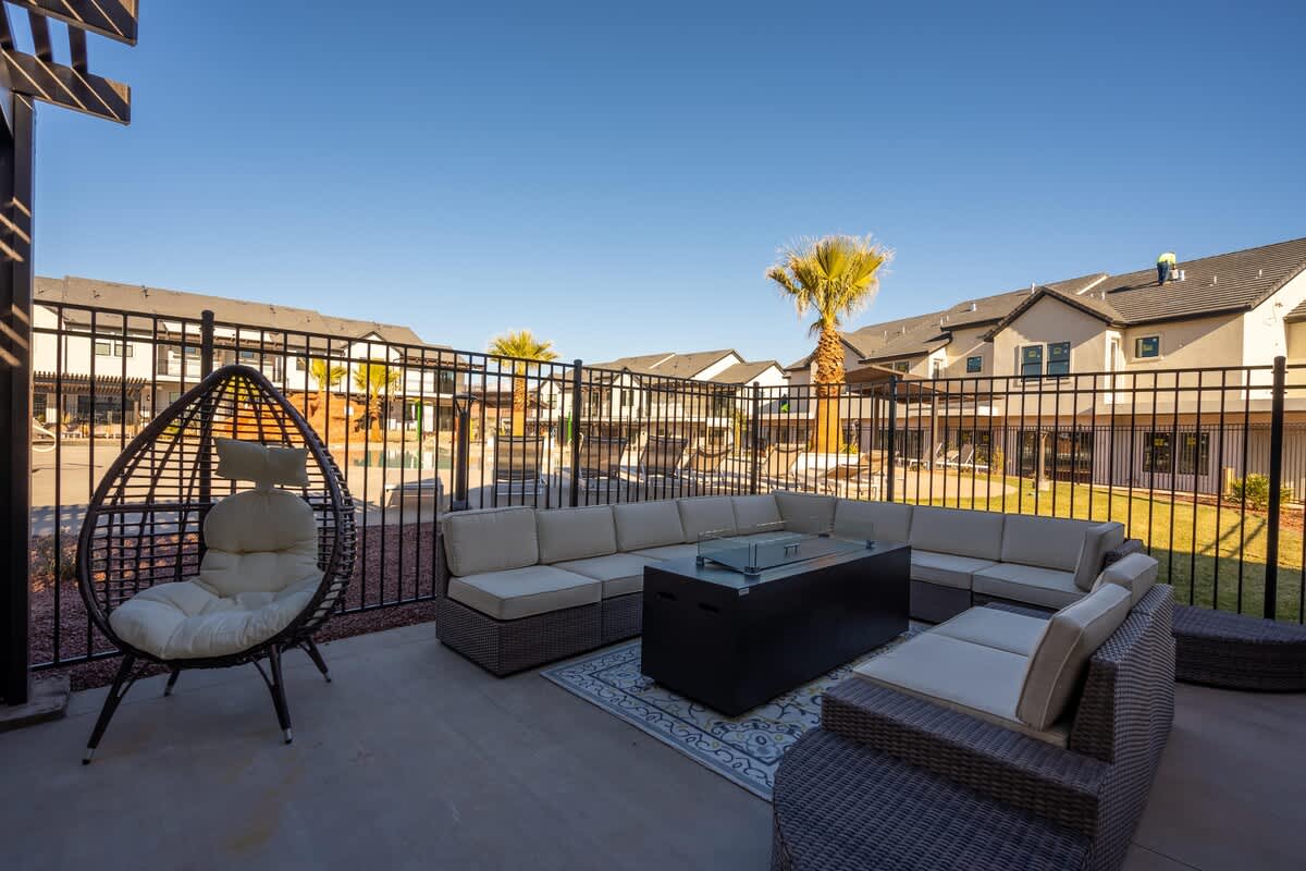 Clubhouse poolside patio with relaxing lounge area and fire pit
