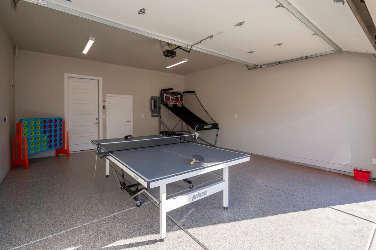 Ping pong table, basketball arcade and Connect 4 in garage