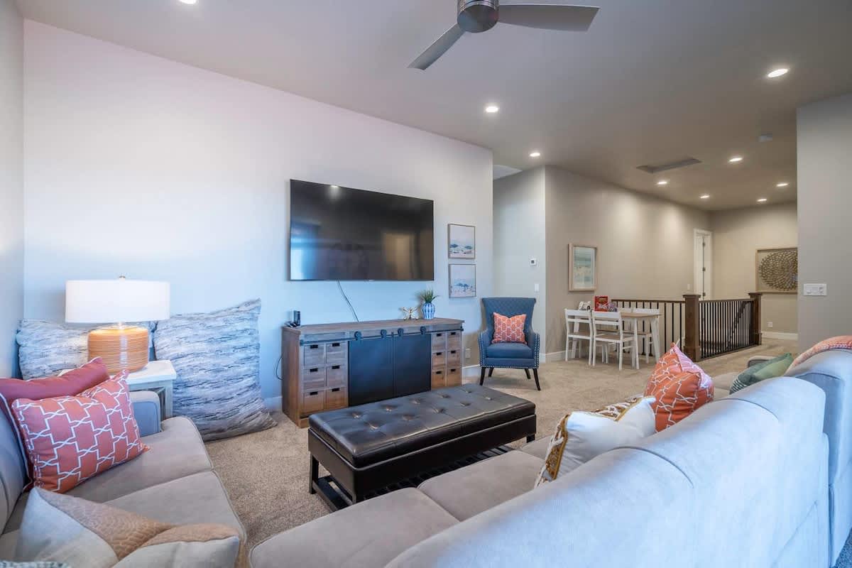 Main open concept family room with comfortable sofas and large T