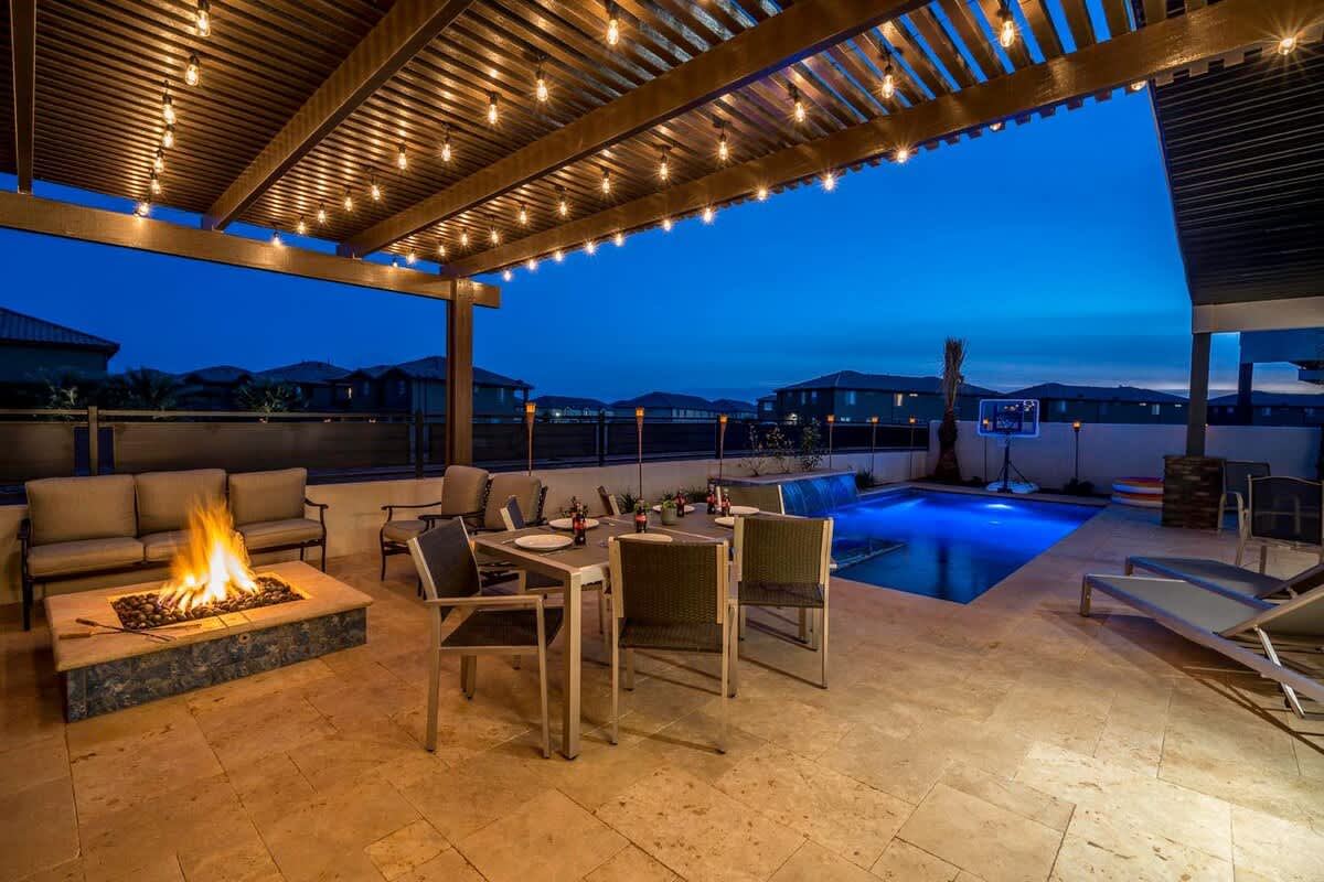 Outdoor patio lit up at night with so much to do and enjoy