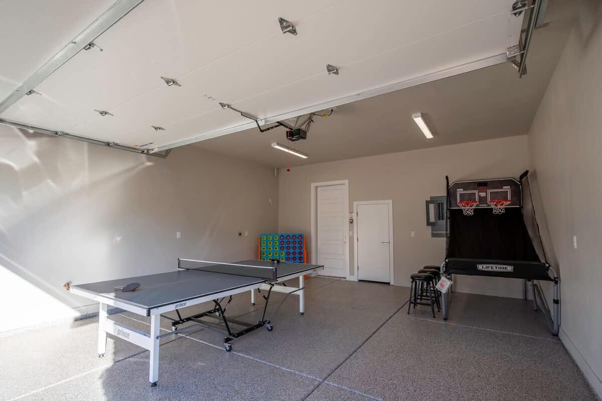 Recreational garage with ping pong and basketball