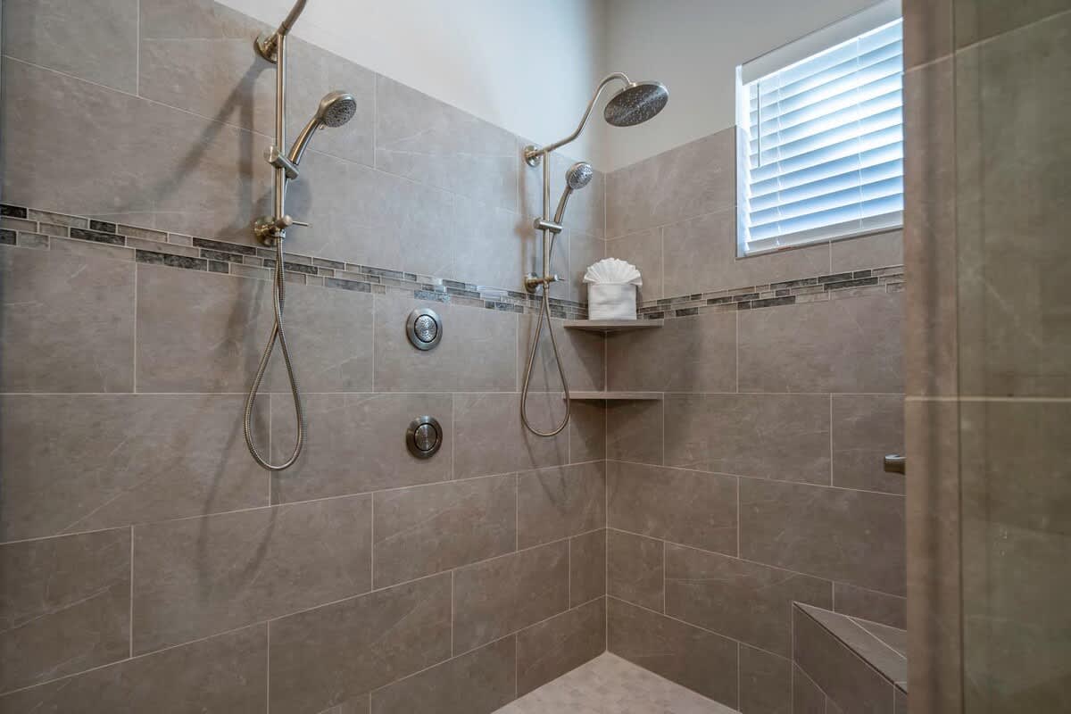 Master bathroom with large shower with 2 shower heads
