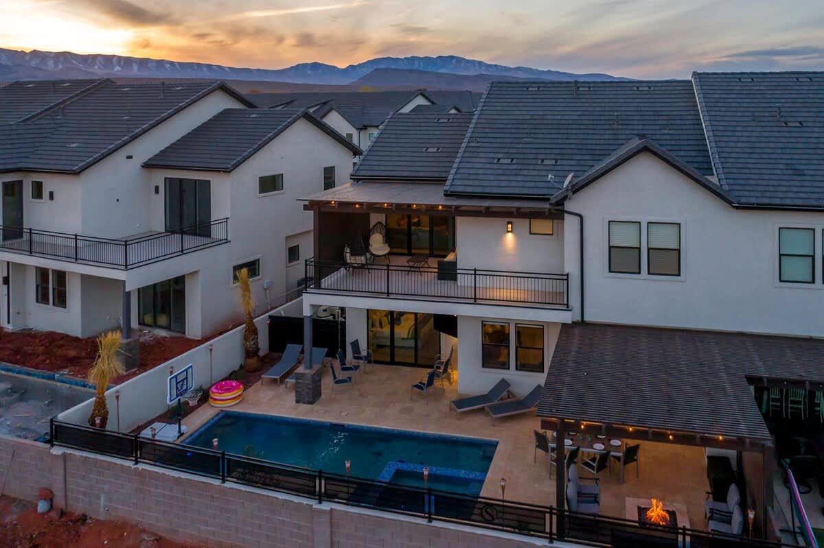 Aerial view of the backyard oasis setting in the evening