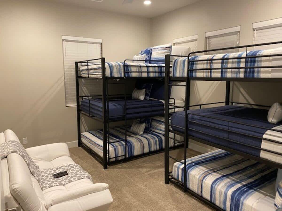 Bedroom 4 upstairs with 2 full over full triple bunks and full f