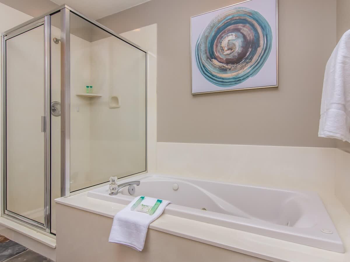 Master bathroom with tub and shower