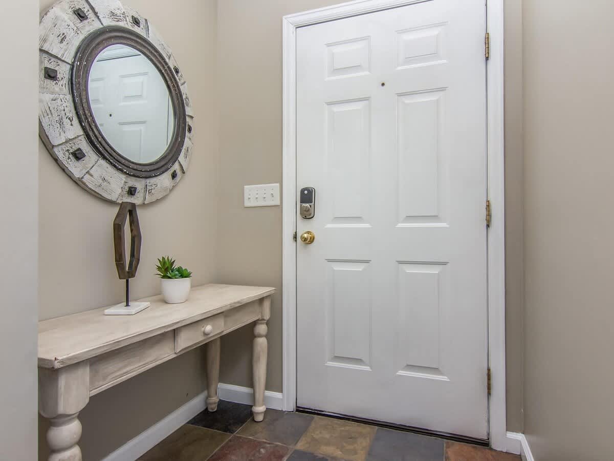 Entry foyer with bench and mirror